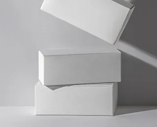 Custom-fit cardboard inserts and dividers securing fragile products within a holiday custom mailer box
