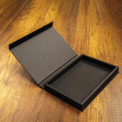 Custom Black Corrugated Boxes open-wooden-black-box-floor copy Blank black box mock up on wood background