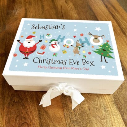 Christmas EVE Boxes Large custom Christmas EVE boxes open, filled with pajamas, books, and small treats for holiday family tradition.