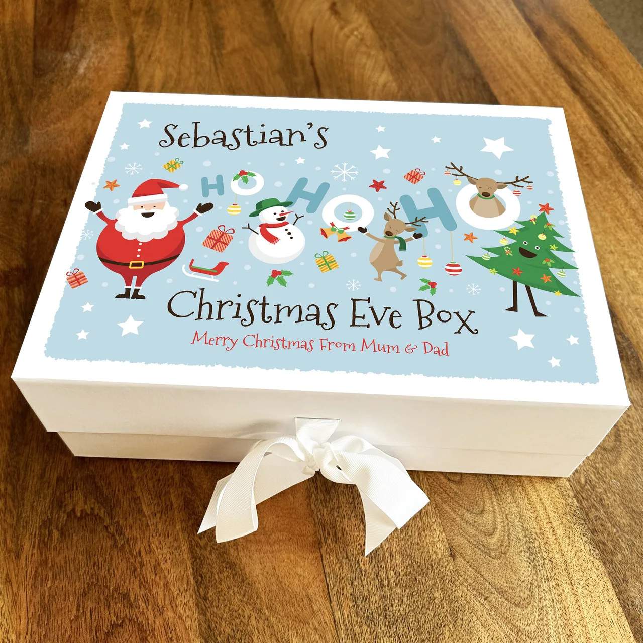 Christmas EVE Boxes Large custom Christmas EVE boxes open, filled with pajamas, books, and small treats for holiday family tradition.
