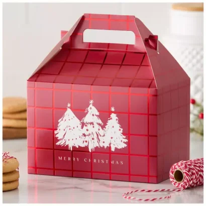 Miniature custom Christmas favor boxes with gold accents, used for holding small wedding or corporate event tokens.